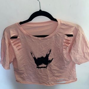 Distressed,cropped, pink tee with rock sign.